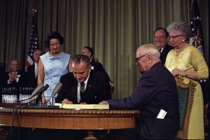 Lyndon B Johnson signing Medicare bill
